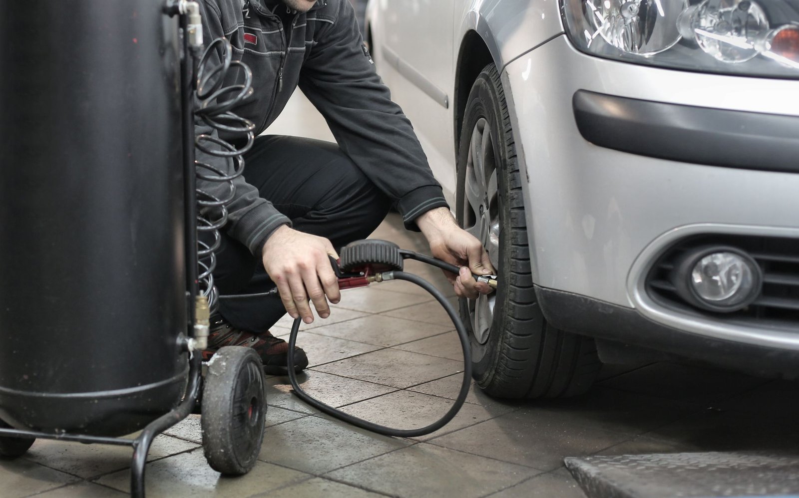 Checking tire pressure with a gauge