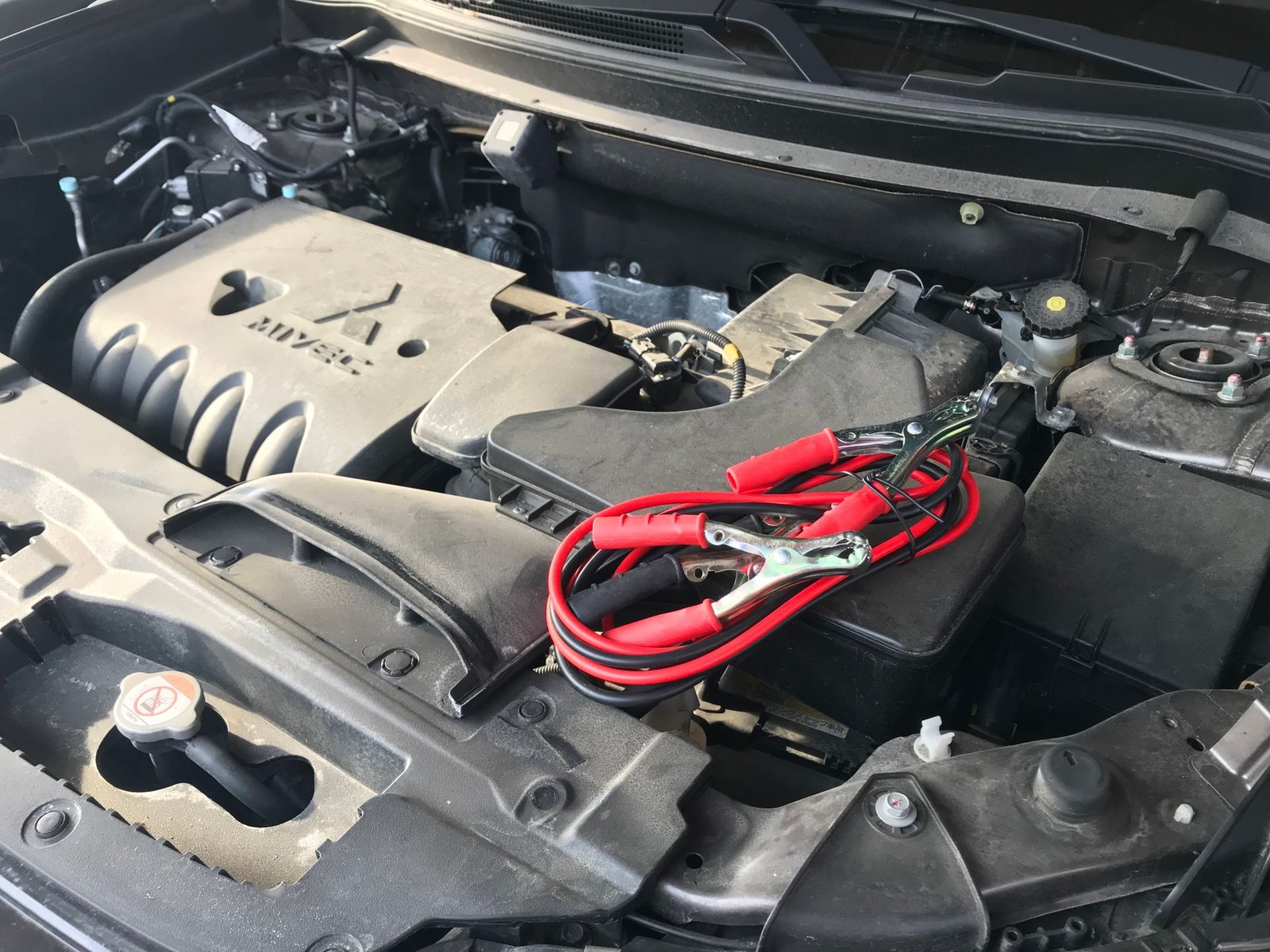A car battery showing its age with corrosion on the terminals